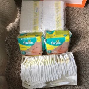 Newborn and size 1 pampers swaddler diapers